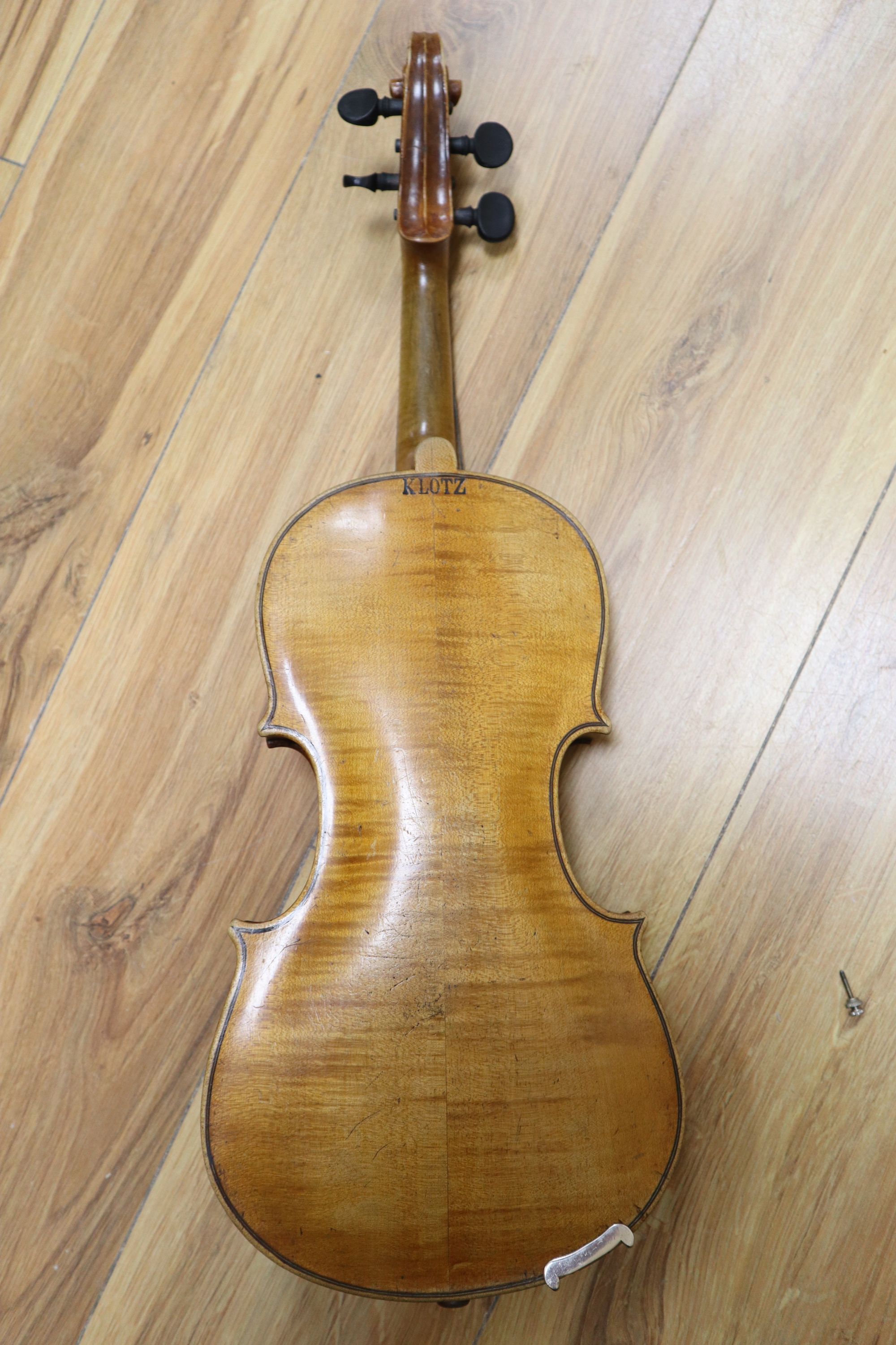 A 3/4 size violin, stamped Klotz, cased, length 52cm